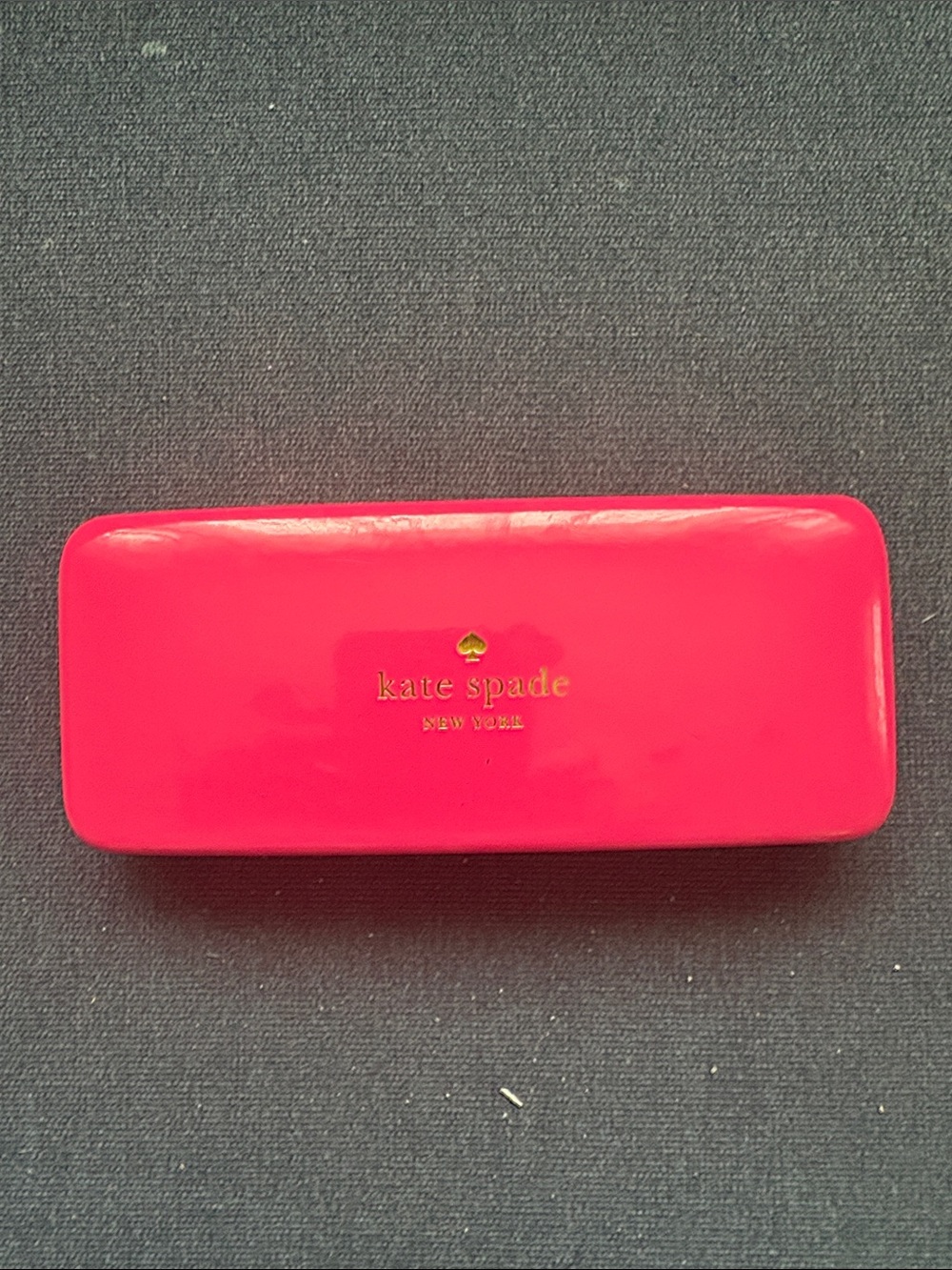 kate spade glossy hot pink eyeglass case with gold logo